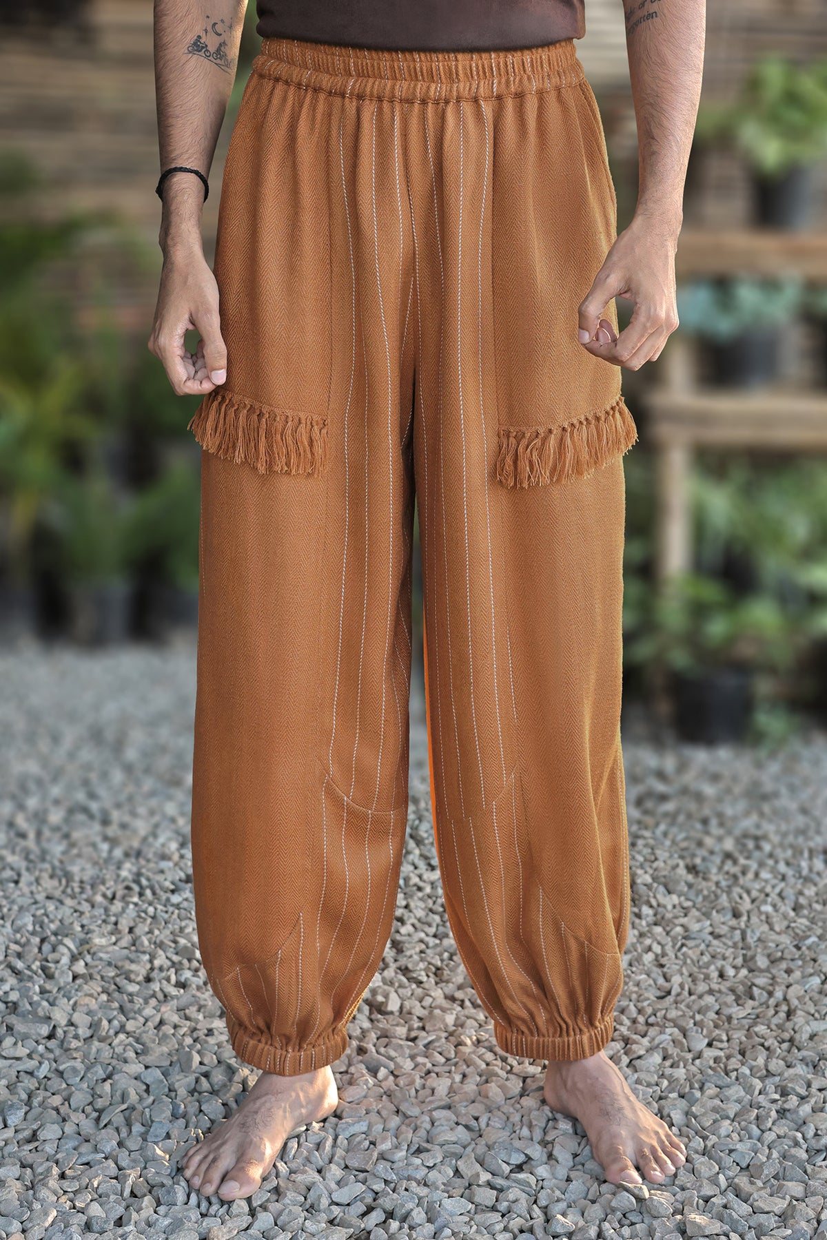 Balloon Pajama in caramel handloom with white pinstripes and fringed pockets, front view