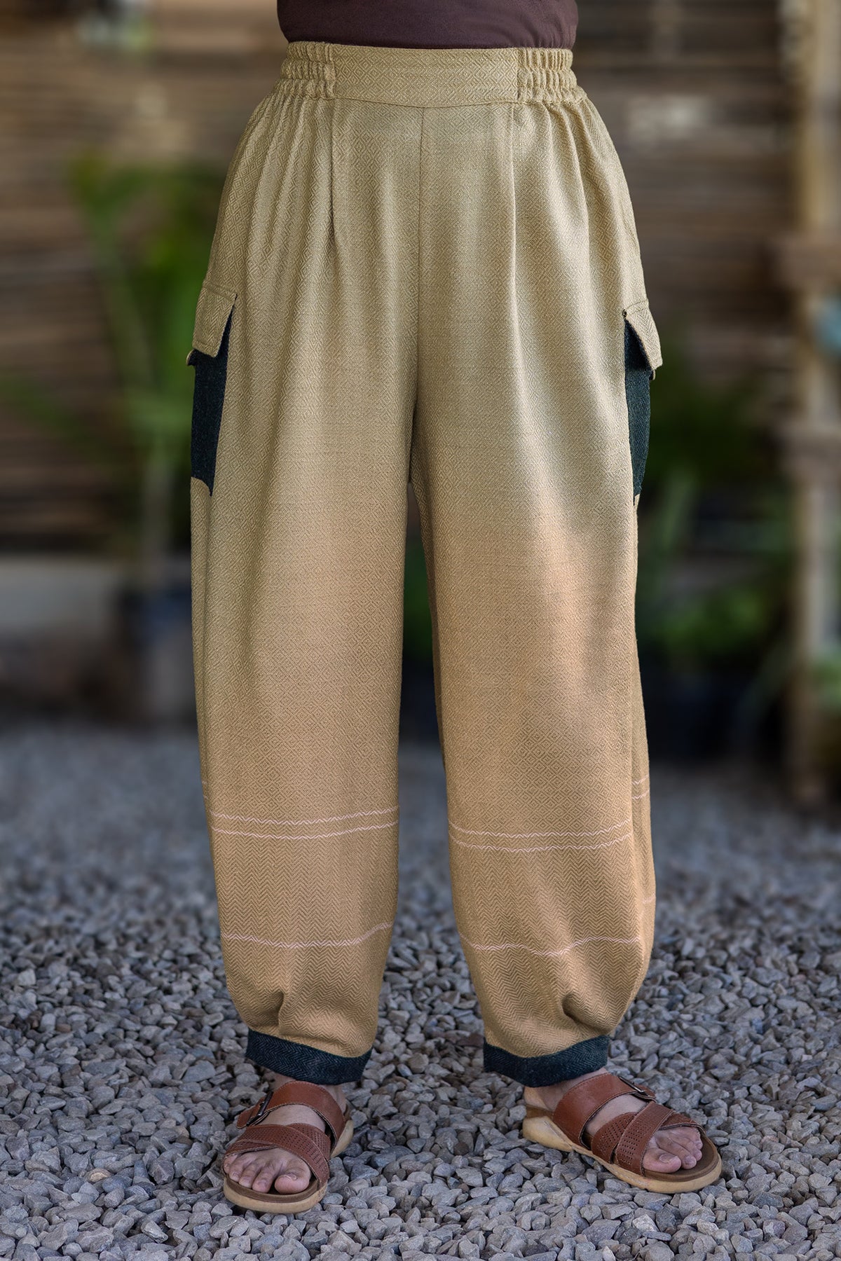 Drift Pant – Oatmeal, front view: pleated waist, dark contrast side pockets and cuffs