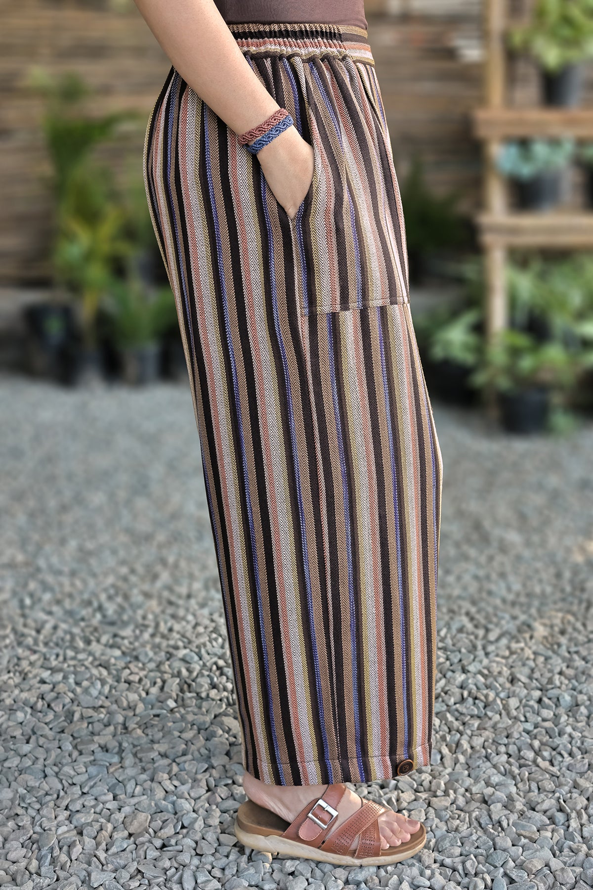 Mellow Pants – Multicolour, side view with a hand in the pocket