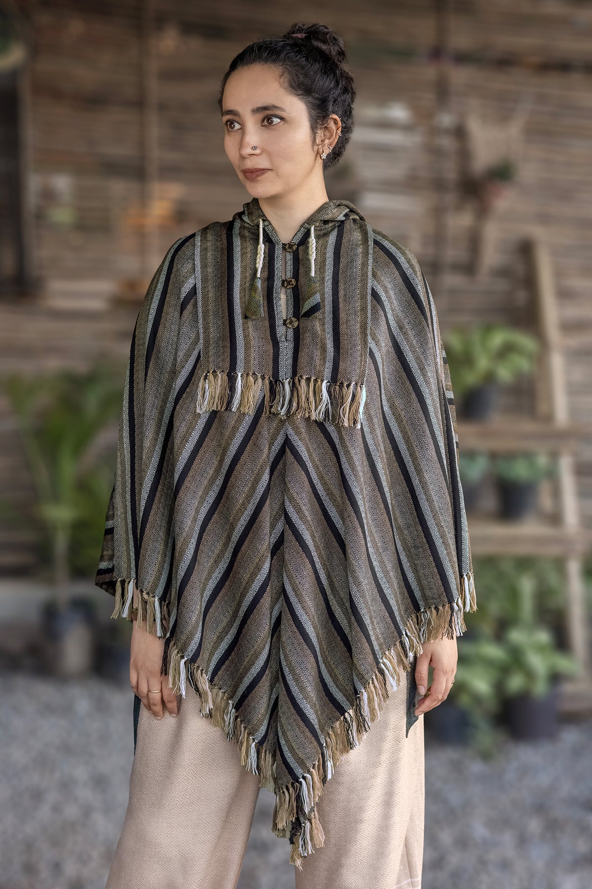 Poncho – Black/Beige, front view: chevron stripes, buttoned neckline and fringed hem